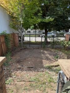 Cleared backyard area after complete wooden gazebo demolition and debris removal in Chicago, IL